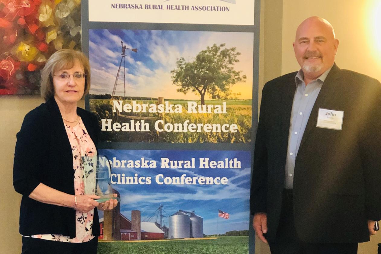 Photo of Schroeder, RN, presented with Nebraskaâ€™s Outstanding Rural Health Achievement Award